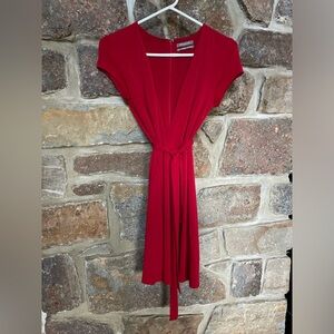 Urban Outfitters red dress. Deep plunging V neck. Belt.